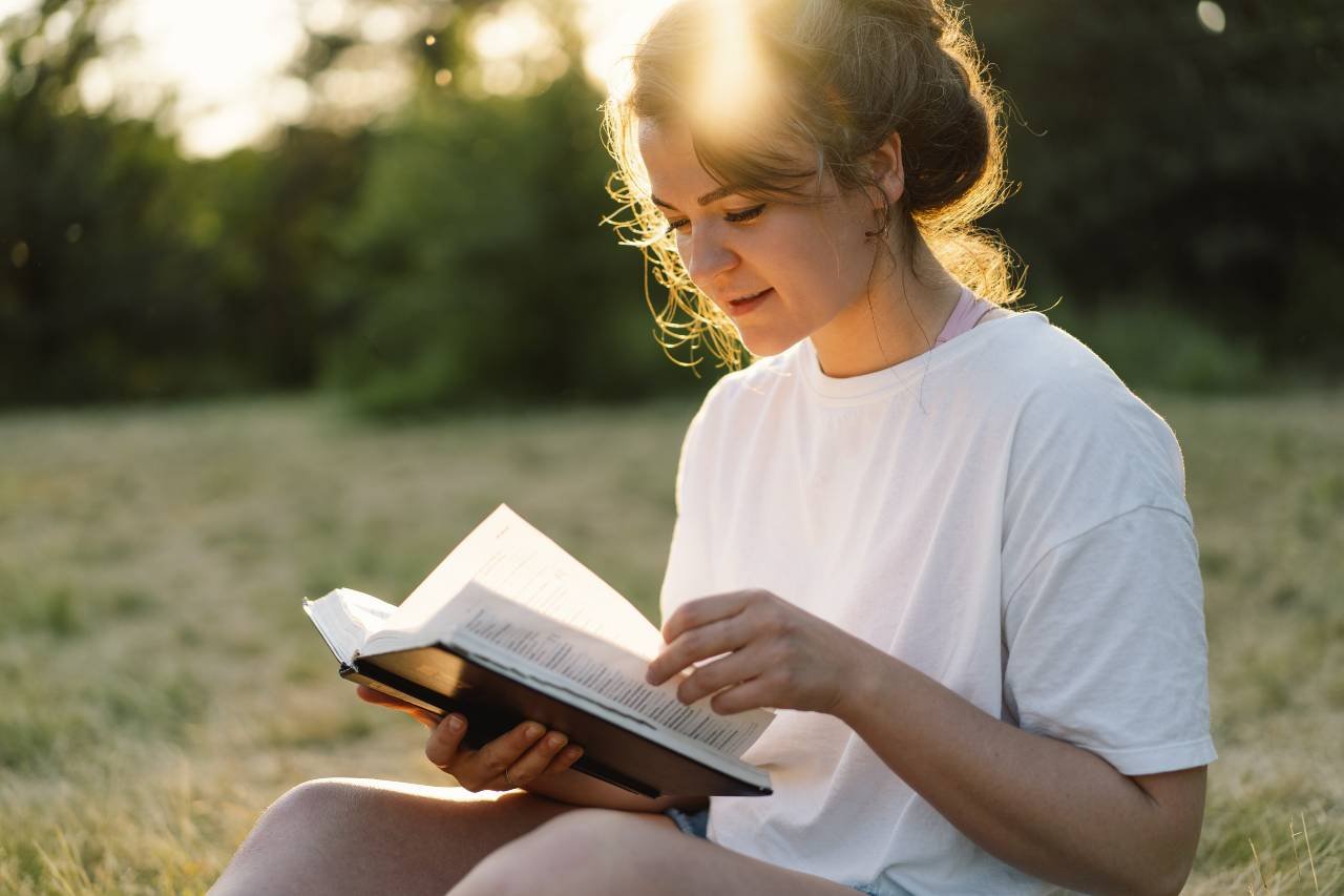 christian-woman-holds-bible-1 christian-woman-holds-bible-1
